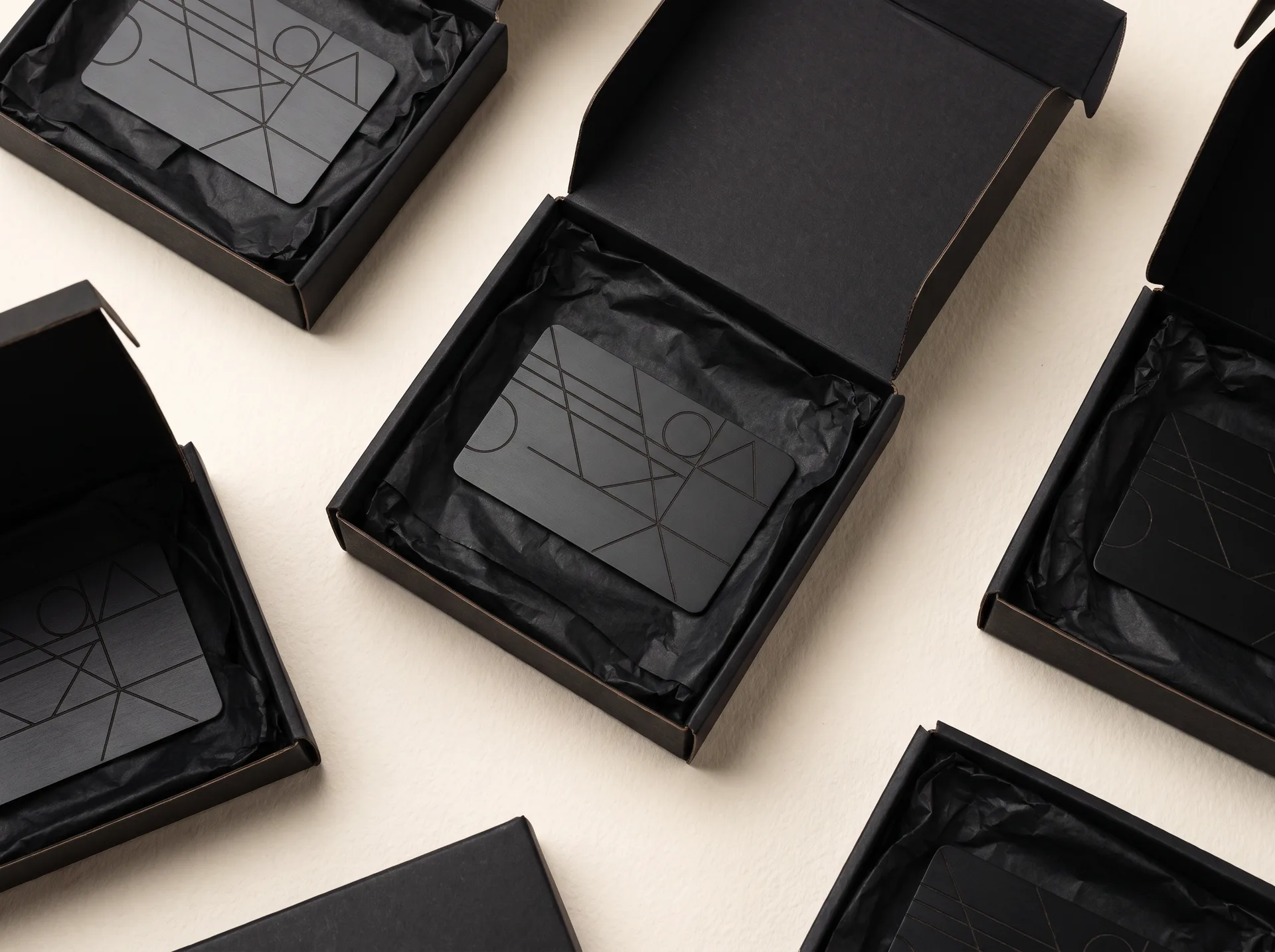 Black Bloom keycards engraved with company logos in gift boxes
